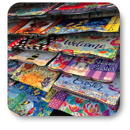 Colorful welcome door mats in the greenhouse atrium at Dewayne's in Selma, NC minutes from Raleigh, Cary, Clayton, Garner, Smithfield, Goldsboro