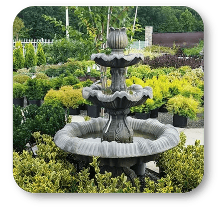Three-tiered stone fountain in the garden center at Dewayne's in Selma, NC minutes from Raleigh, Cary, Clayton, Garner, Smithfield, Goldsboro 