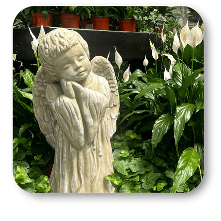 Stone angel statue in the atrium at Dewayne's in Selma, NC minutes from Raleigh, Cary, Clayton, Garner, Smithfield, Goldsboro 