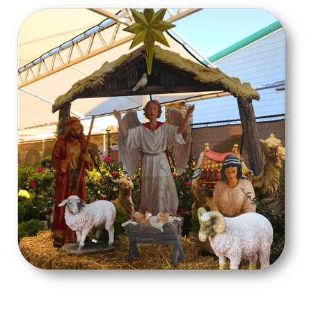 Outdoor metal Nativity scene with figures and animals in a garden setting at Dewayne's in Selma, NC minutes from Raleigh, Cary, Clayton, Garner, Smithfield, Goldsboro