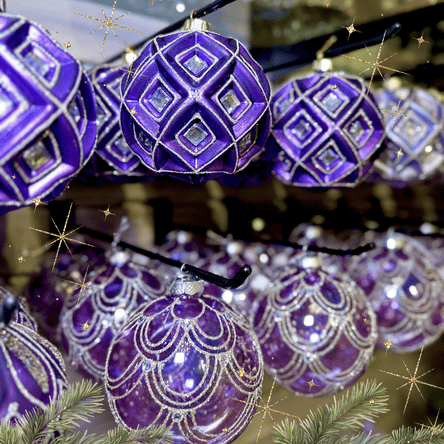 purple ornaments and christmas decor in the gold and glamour room in christmas land 2025 at dewayne's