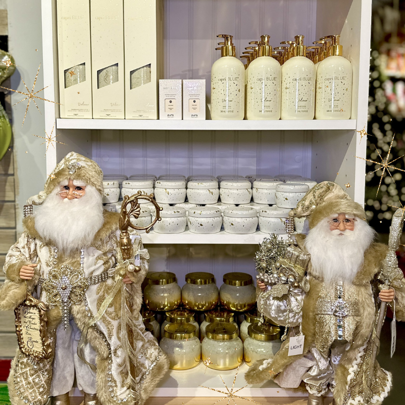 gold santa figurines and scented candles in the gold and glamour room in christmas land 2025 at dewayne's