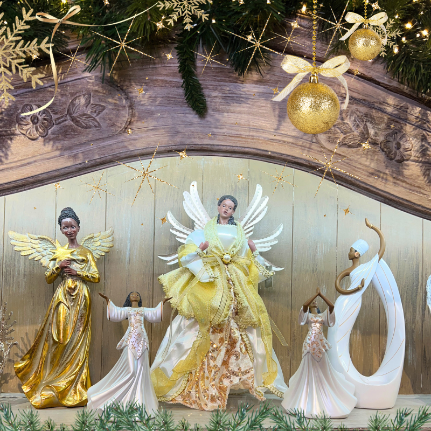 Decorative african american angels figurines  in the gold and glamour room in christmas land 2025 at dewayne's
