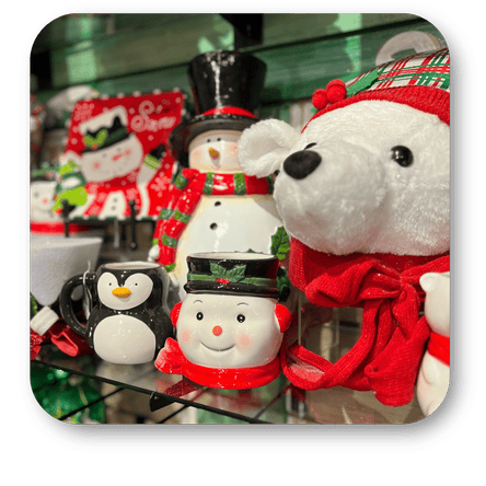 Decorative Christmas snowmen, penguin mugs, and teddy bears in the grand entrance room of christmas land 2025 at Dewayne's in Selma, NC minutes from Raleigh, Cary, Clayton, Garner, Smithfield, Goldsboro