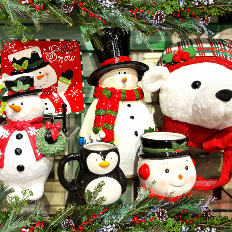 Decorative Christmas items including snowmen, penguins, and a teddy bears with festive attire 