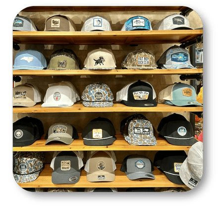 Display of various hats ball caps in the men's shoppe at Dewayne's in Selma, NC minutes from Raleigh, Cary, Clayton, Garner, Smithfield, Goldsboro