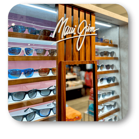 Display of sunglasses with 'Maui Jim' logo in the men's shoppe at Dewayne's in Selma, NC minutes from Raleigh, Cary, Clayton, Garner, Smithfield, Goldsboro