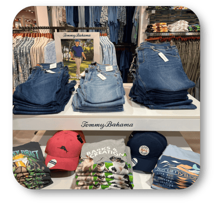 Display of jeans and clothing with Tommy Bahama branding in the men's shoppe at Dewayne's in Selma, NC minutes from Raleigh, Cary, Clayton, Garner, Smithfield, Goldsboro