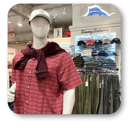 Mannequin wearing a red patterned shirt with a maroon scarf - tommy bahama clothing and caps in the men's shoppe at Dewayne's in Selma, NC minutes from Raleigh, Cary, Clayton, Garner, Smithfield, Goldsboro