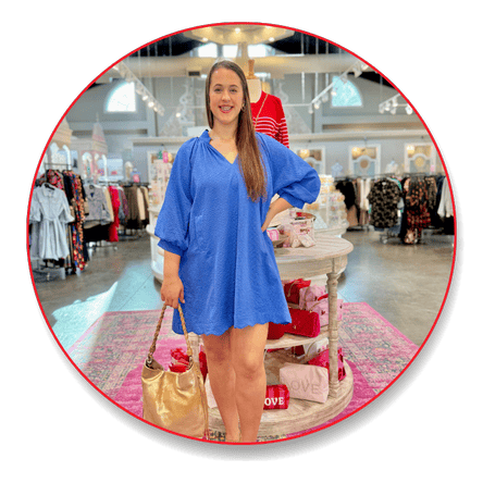 Woman in a blue dress standing in the boutique at Dewayne's in Selma, NC minutes from Raleigh, Cary, Clayton, Garner, Smithfield, Goldsboro