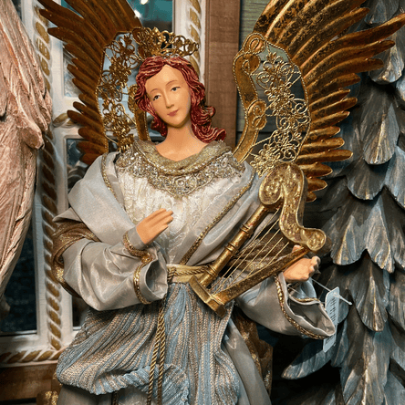 blue and gold angel figurine in the moments in thyme room in christmas land at dewayne's in selma, nc