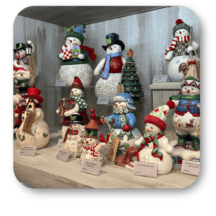 Collection of decorative snowmen figurines with various outfits and accessories by 'Possible Dreams' in the timeless treasures room in christmas land at Dewayne's in Selma, NC minutes from Raleigh, Cary, Clayton, Garner, Smithfield, Goldsboro