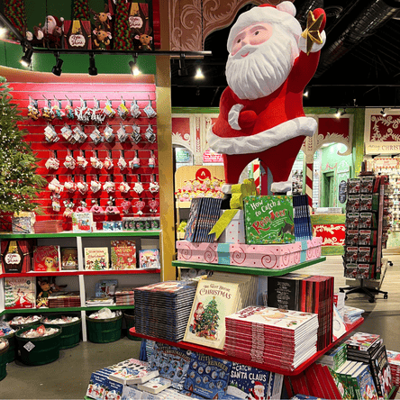 christmas childrens books and large santa display in santa's workshop in christmas land at dewayne's in selma, NC