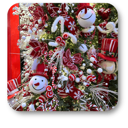 Decorated Christmas tree with red, white, snowmen ornaments in christmas land at Dewayne's in Selma, NC minutes from Raleigh, Cary, Clayton, Garner, Smithfield, Goldsboro