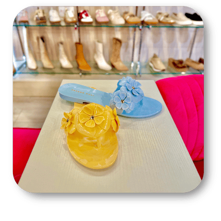Colorful ladies slip-in shoes with floral designs in the boutique at Dewayne's in Selma, NC minutes from Raleigh, Cary, Clayton, Garner, Smithfield, Goldsboro
