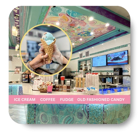 Ice cream shop interior with a person holding an ice cream cone, colorful ceiling, and menu board in the sweet shop at Dewayne's in Selma, NC minutes from Raleigh, Cary, Clayton, Garner, Smithfield, Goldsboro
