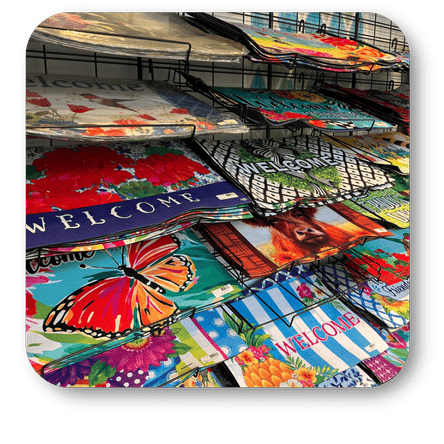Colorful welcome door mats in the greenhouse atrium at Dewayne's in Selma, NC minutes from Raleigh, Cary, Clayton, Garner, Smithfield, Goldsboro