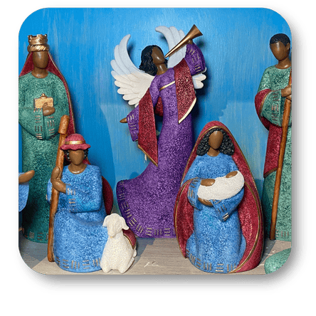 Decorative nativity scene with colorful figurines against a blue background in Christmas Land at Dewayne's in Selma, NC minutes from Raleigh, Cary, Clayton, Garner, Smithfield, Goldsboro