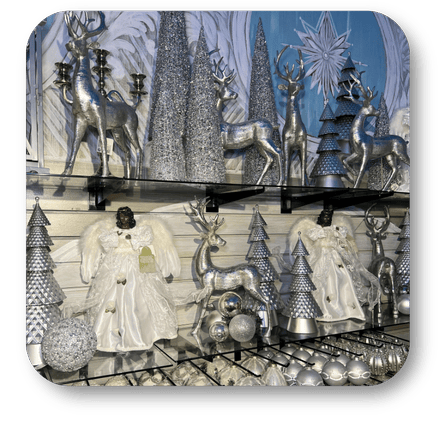 Decorative Christmas scene with silver reindeer, trees, and angels in Christmas Land at Dewayne's in Selma, NC minutes from Raleigh, Cary, Clayton, Garner, Smithfield, Goldsboro