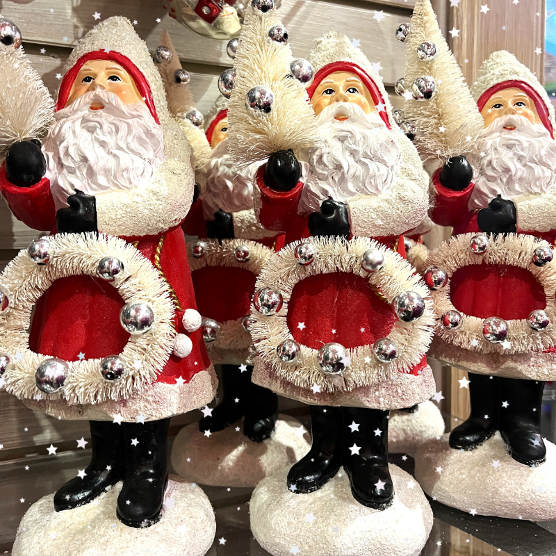 Decorative Santa Claus figures with wreaths in the wrapped in red room in christmas land 2025 at dewaynes