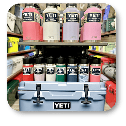 YETI brand bottles displayed on a shelf with a cooler in the foreground  in the gift shop at Dewayne's in Selma, NC minutes from Raleigh, Cary, Clayton, Garner, Smithfield, Goldsboro